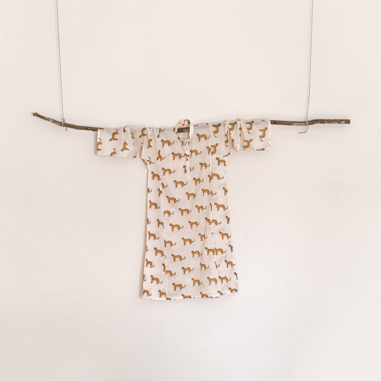 Cheetah motif in warm ochre on White base