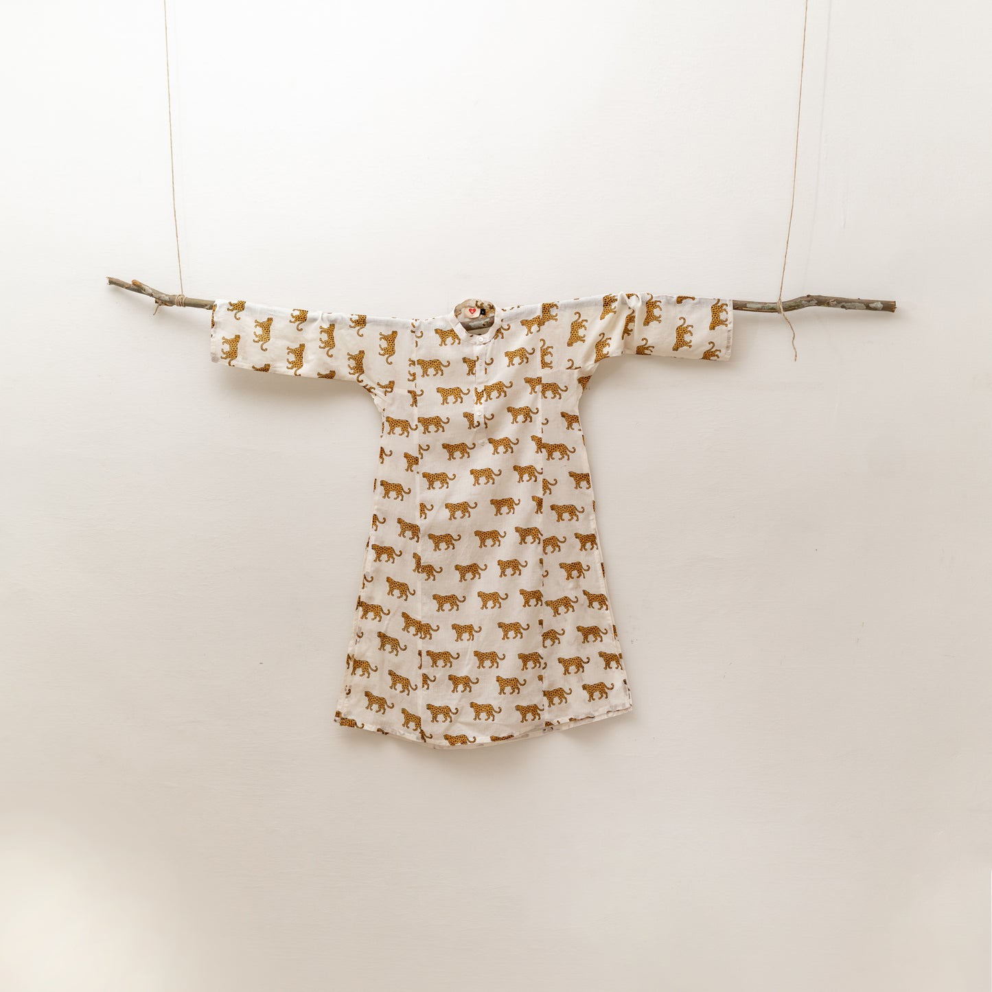 Leopard motif in warm ochre on White base